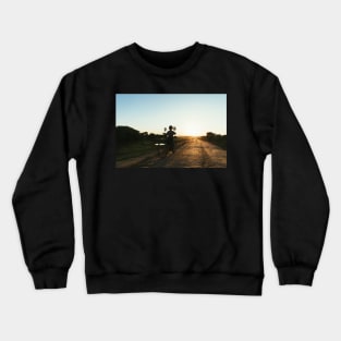 Silhouette of Boy Riding Bicycle at Sunset in Burmese Countryside Crewneck Sweatshirt